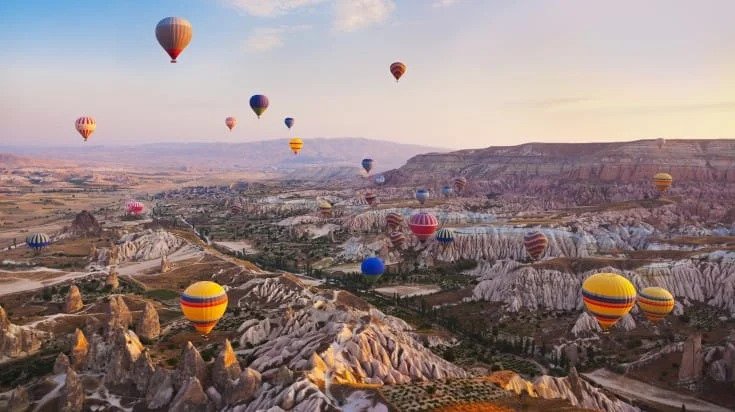 Top 10 Vacation Spots Around the Globe That Will Blow Your Mind 2 Hot Ballons are flying in sky with incredible vication