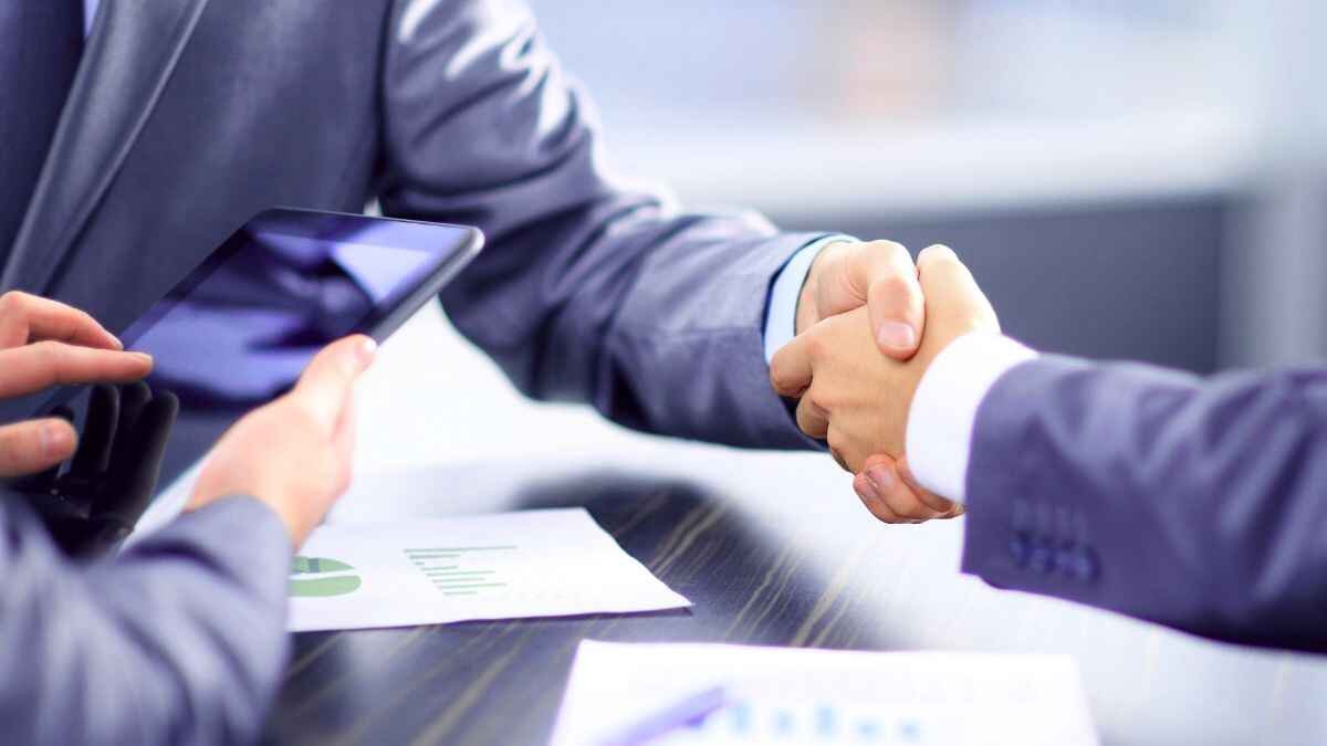 Two Bank Employs Handshakes Each Other