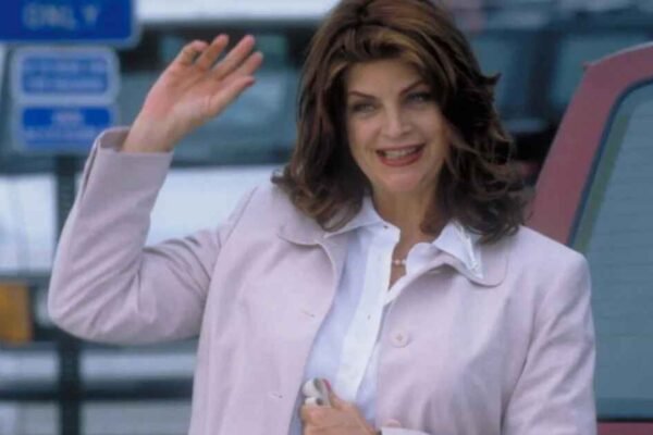 Kirstie Alley Net Worth: Inside Her Life, Fame & Fortune kirstie alley saying hi and showing her Kirstie Alley Net Worth
