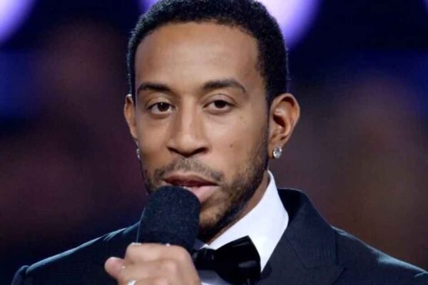 holding a mic and giving speech about ludacris net worth