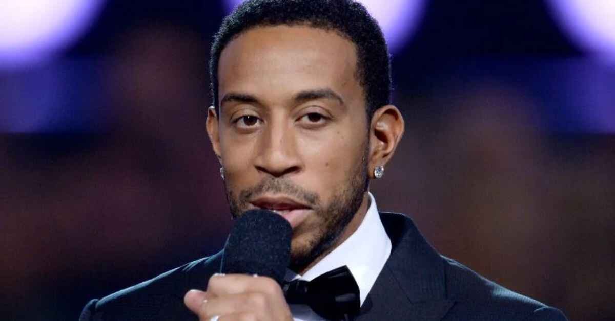 holding a mic and giving speech about ludacris net worth