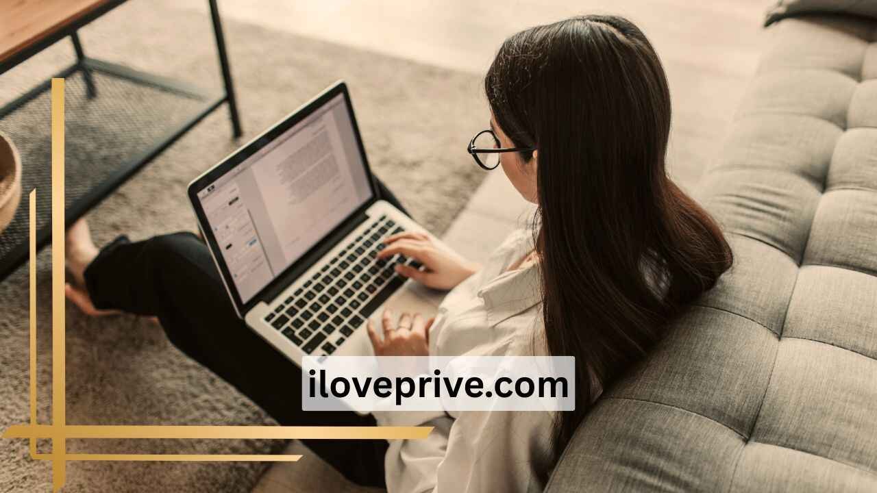A girl sitting and using iloveprive.com on laptop