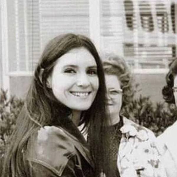 Thelma Riley: Ozzy Osbourne’s First Wife & Her Life Away from Fame 2 Old Photo of Thelma Riley standing and her mom visible behind her.