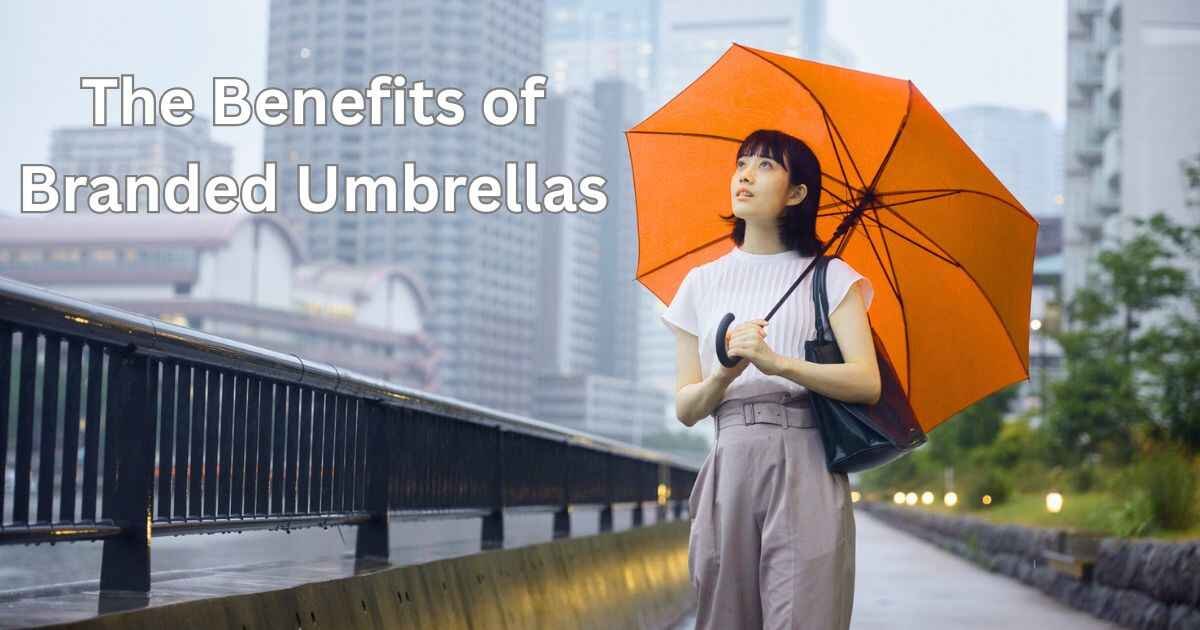 Woman holding umbrella in rain with heading "The Benefits of Branded Umbrellas"