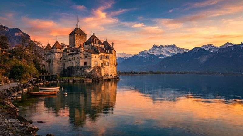 Chillon Castle on Lake Geneva near Montreux at sunset.